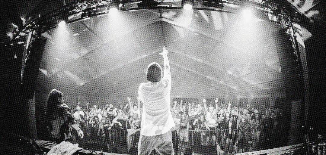 Performer on stage with crowd